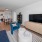a living room with a tv and couches