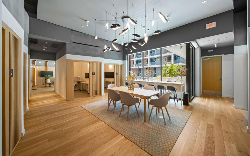 a large room with a table and chairs