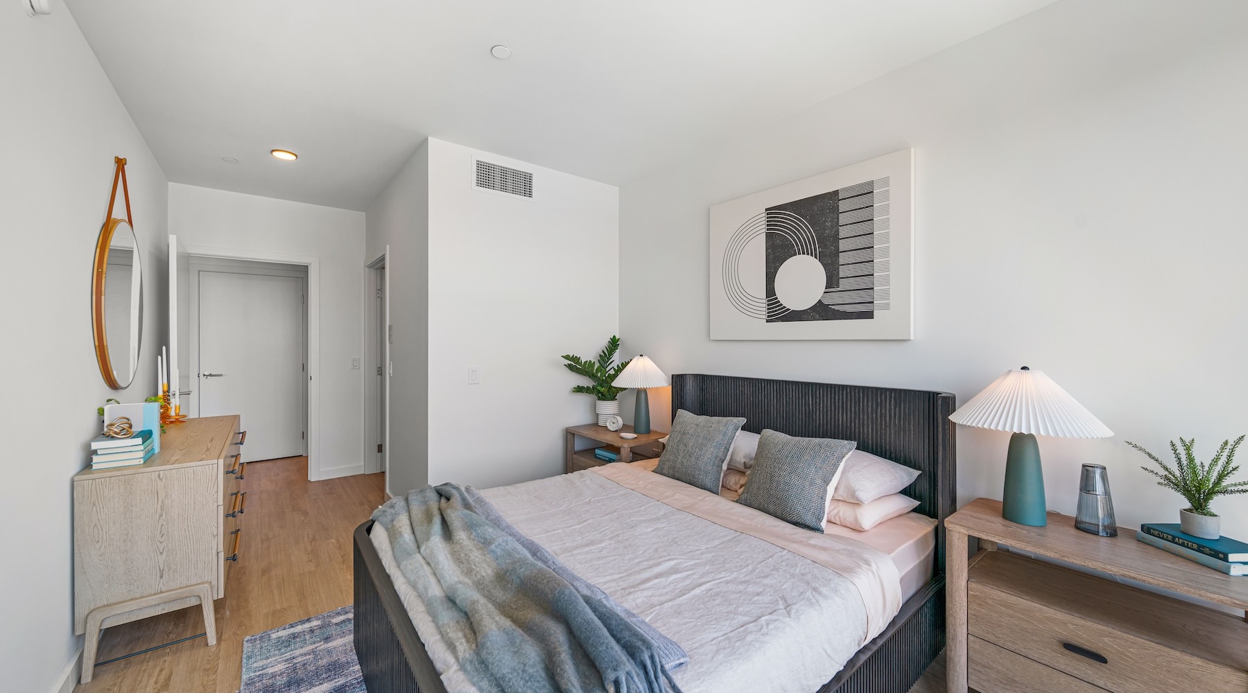 Beautiful bedrooms to fit every need a bedroom with a bed and a dresser