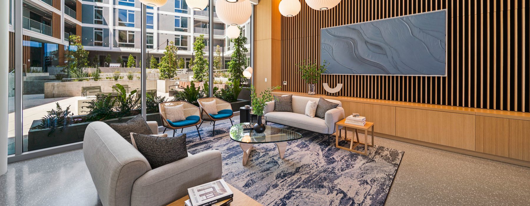 a room with a couch and chairs