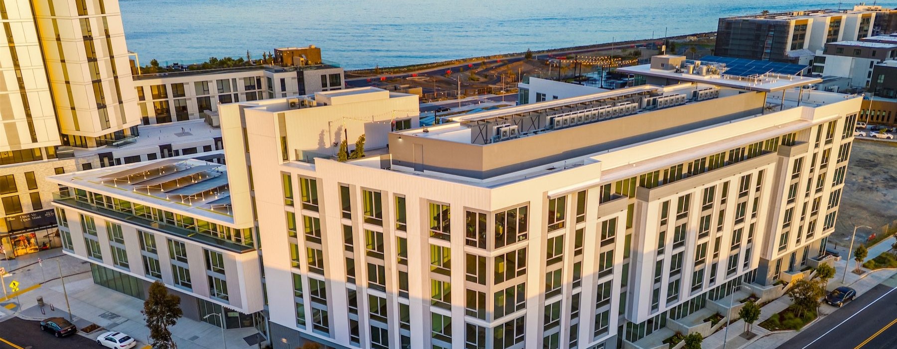 a city with a body of water in the background