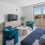 a living room with a blue couch and a tv