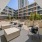a courtyard with chairs and tables