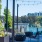 a patio with chairs and a body of water in the background