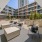a courtyard with chairs and tables