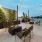 a patio with chairs and tables