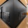 a hallway with a black wall