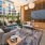 a room with a couch and chairs